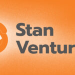 Stan Ventures logo with an orange circular design and gray text on a textured orange background.