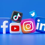 3D icons of Facebook, TikTok, Twitter, YouTube, Instagram, and LinkedIn on a blue background.